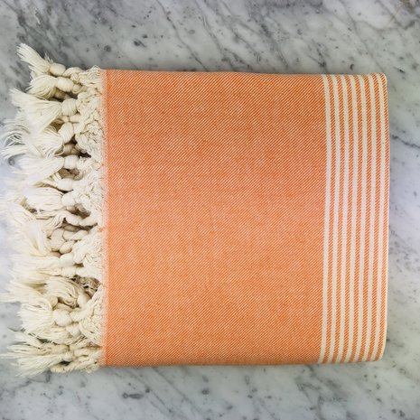 Oranje hamam handdoek van bio katoen verkrijgbaar bij GreenPicnic