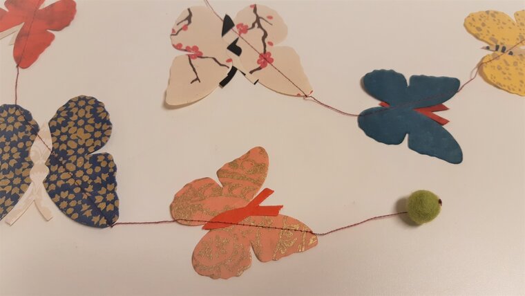 Fairtrade vlinder slinger uit Nepal